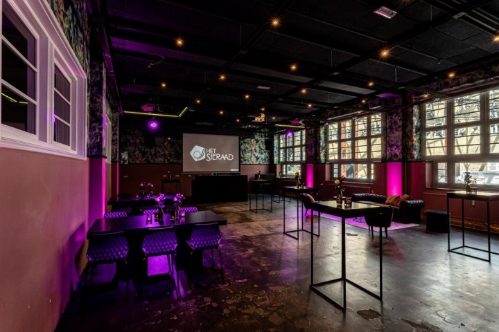 a room filled with purple flowers